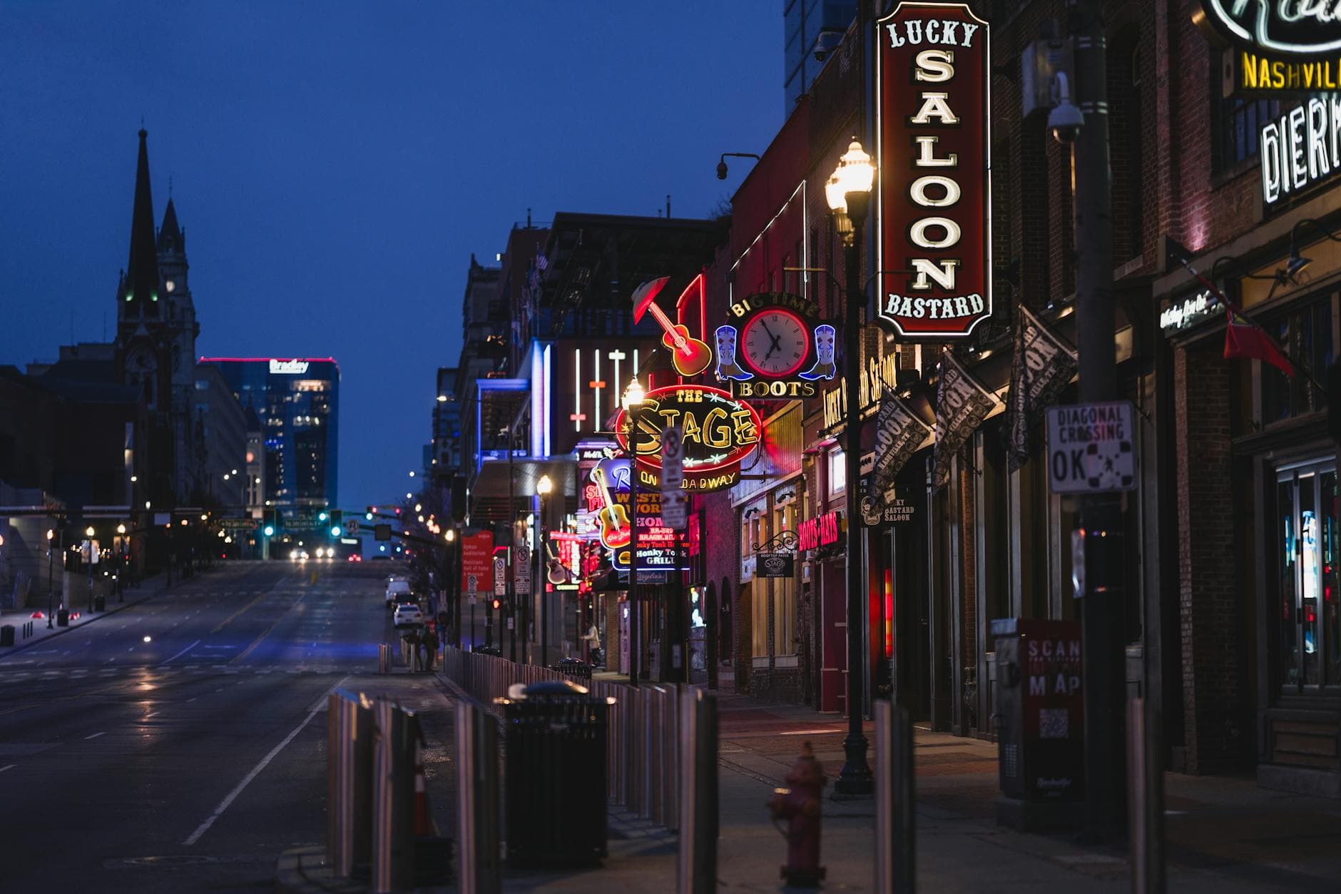 Lower Broadway in Nashville at golden hour — gathering night for The Experience members