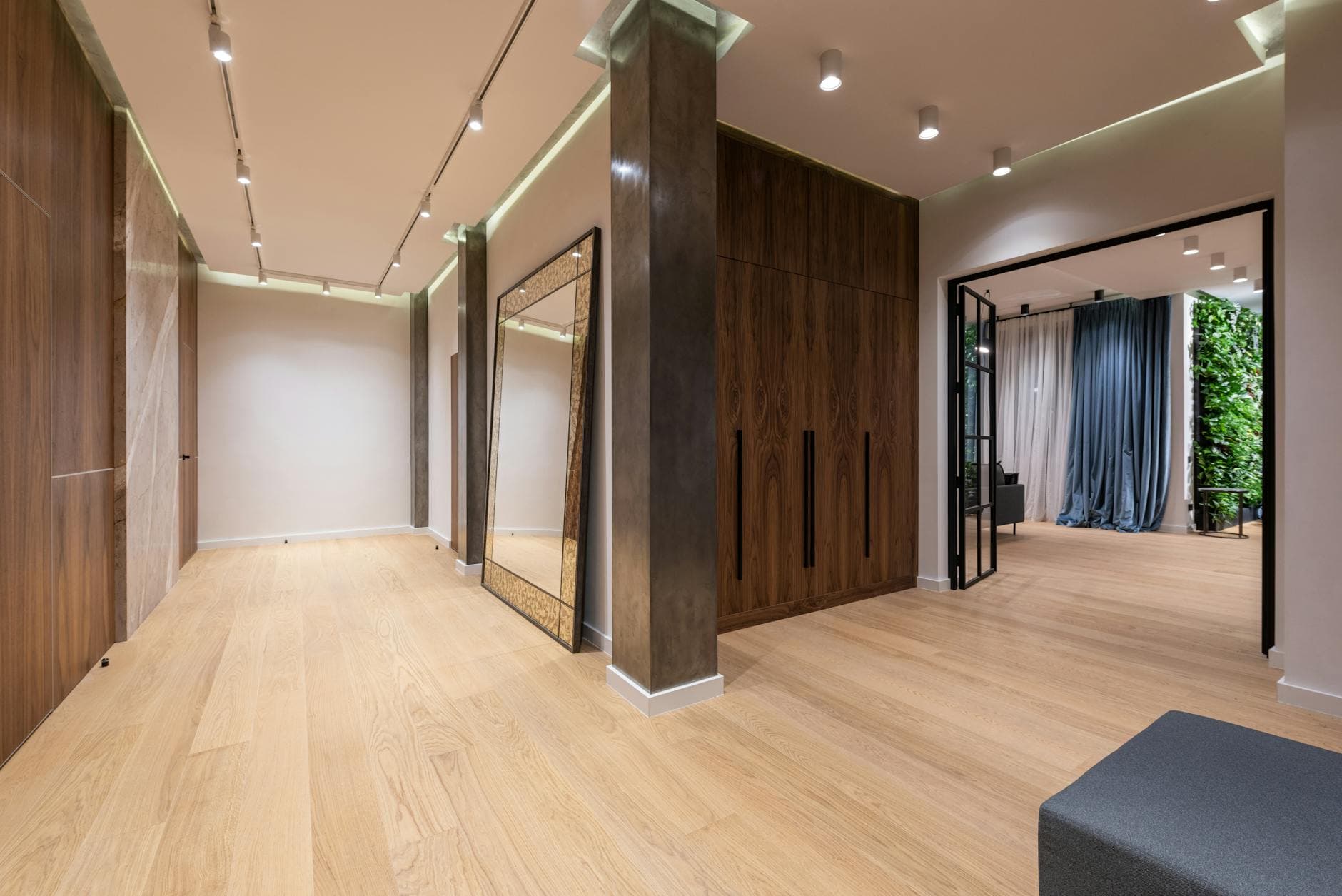Material detail of an upscale Tennessee home interior — wood, stone, and natural light at the threshold