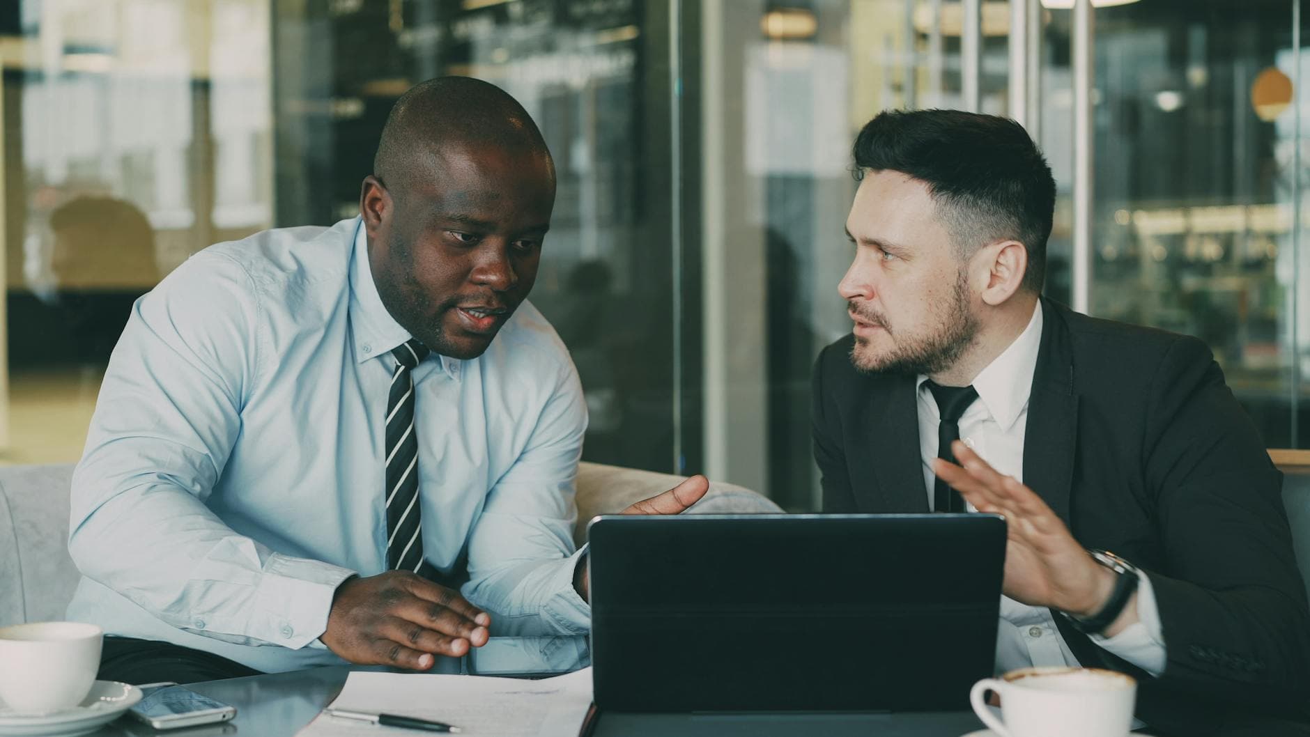 Two agents practicing a buyer-consultation role play — ACTIVATE script training, Nashville market center