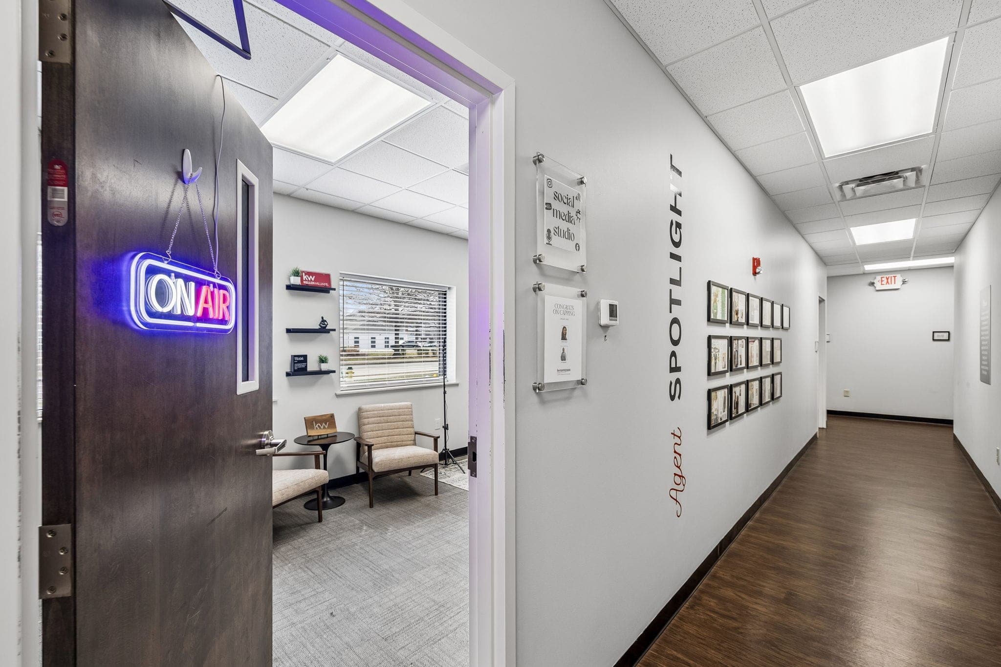 The Agent Spotlight wall and On Air studio inside a KW Empower market center