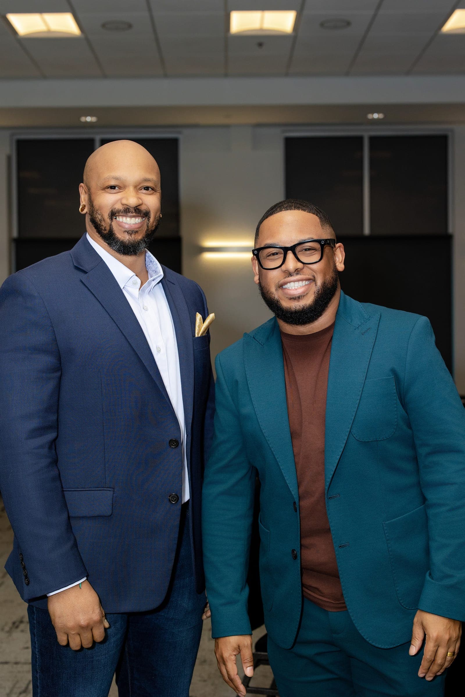 Two Empower leaders in blazers standing together after a Middle Tennessee agent training session